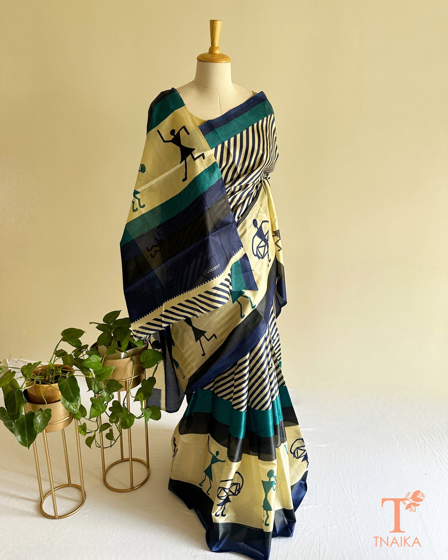 Contemporary satin silk saree featuring abstract motifs, smooth drape, and elegant striped pallu