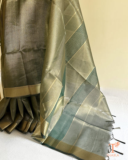 Elegant muted green tissue silk checks saree with luminous sheen, woven zari borders, and tassel pallu accents