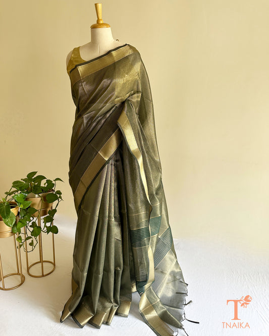 Lightweight muted green tissue silk saree with soft shimmer and traditional woven zari detailing