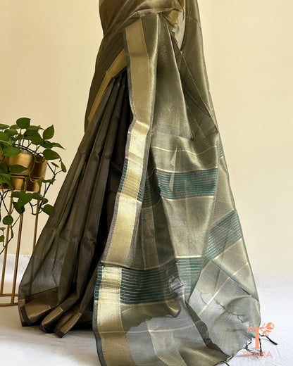 Muted dark green tissue silk saree with golden zari border and striped pallu detailing in lightweight festive drape