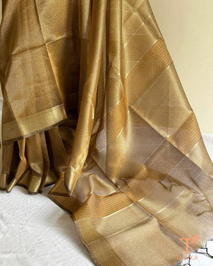 Elegant muted brown gold tissue silk saree with airy translucent drape and rich zari woven border