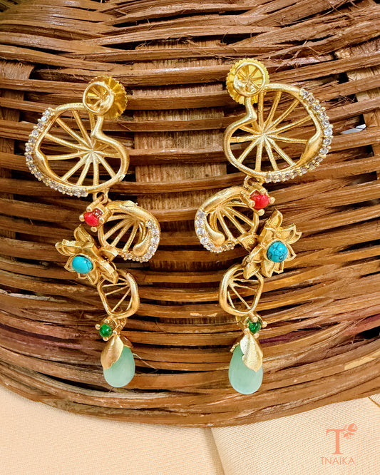 Gold finish brass earrings with AD stone work, floral motifs and elegant drop detailing.