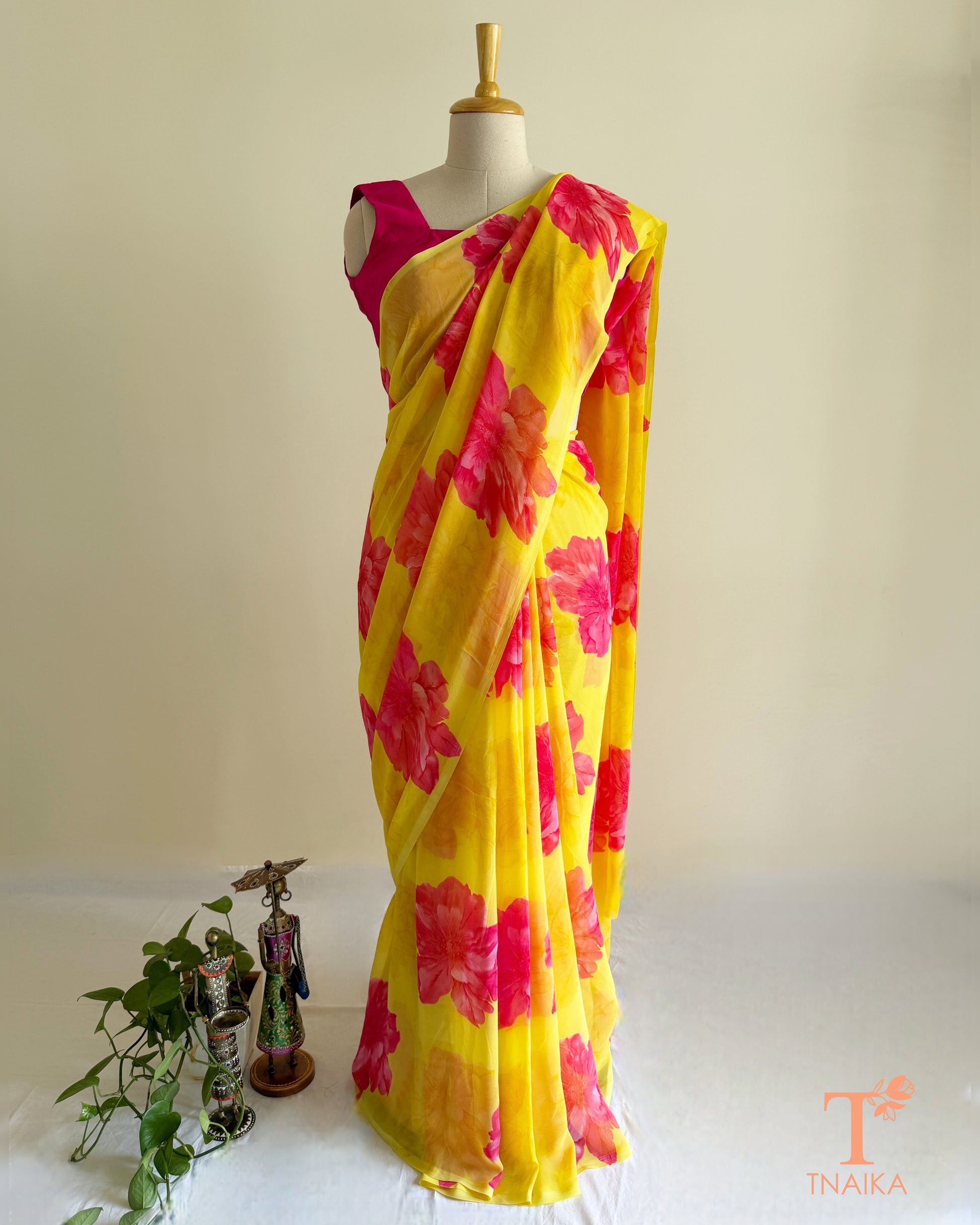 Bright yellow saree with pink blossom design