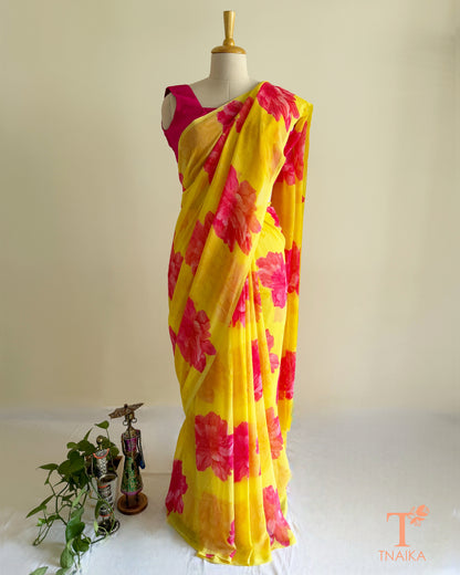 Bright yellow saree with pink blossom design