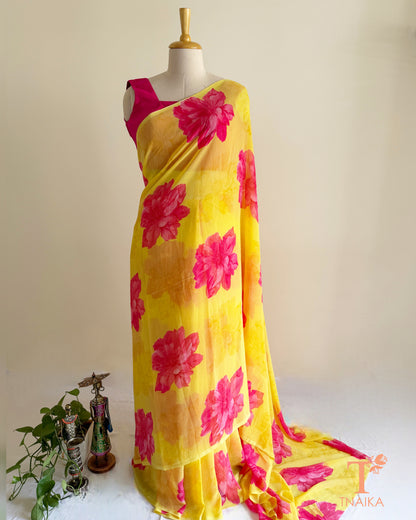 Yellow georgette saree with large pink floral prints
