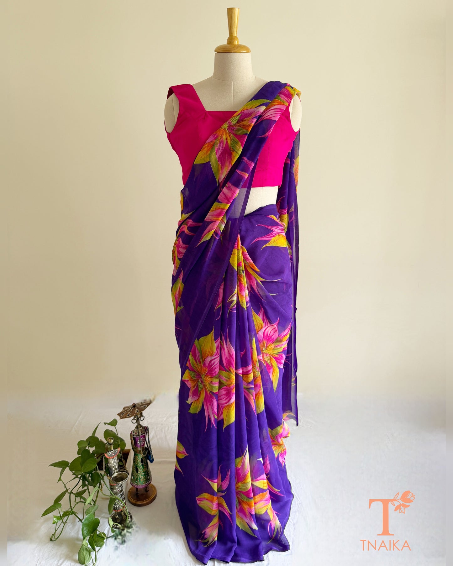 Lightweight violet saree with pink and yellow blossoms