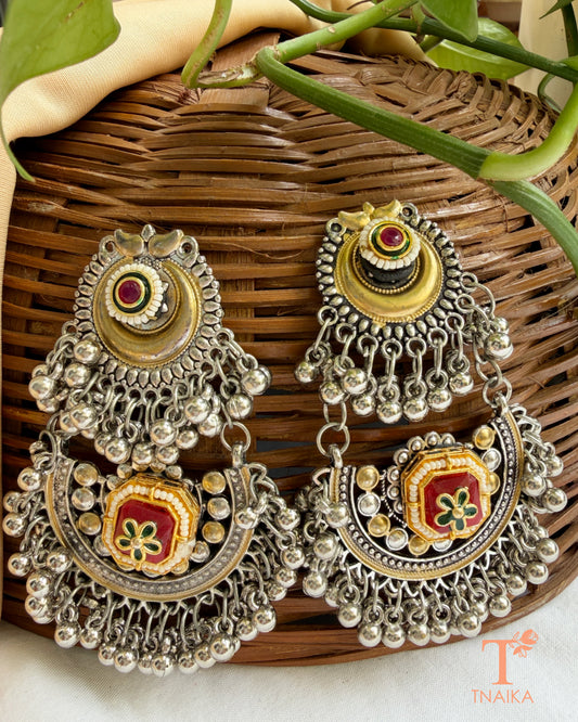 Silver replica chandbali earrings with meena work, pearl detailing and ghungroo accents.