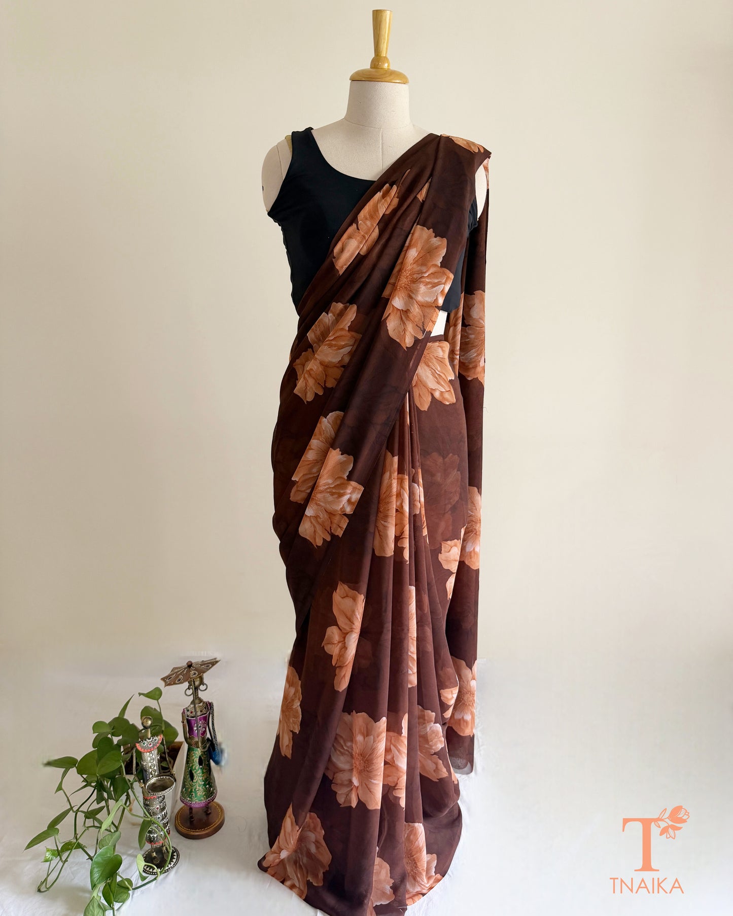 Brown saree with light brown blossom design