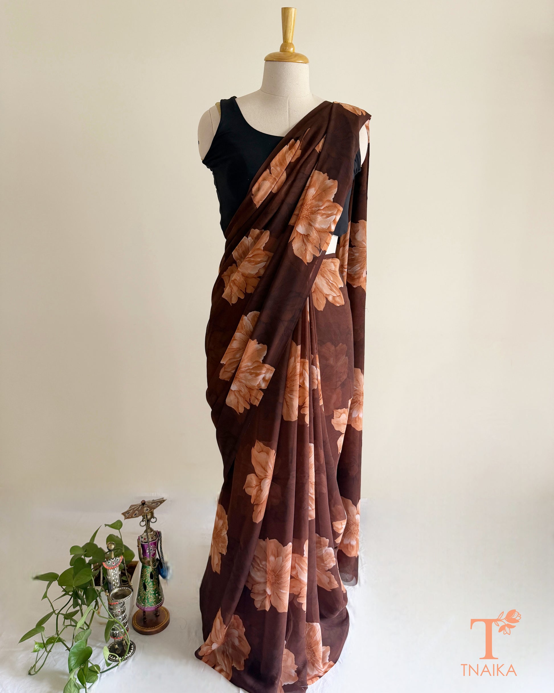 Brown saree with light brown blossom design