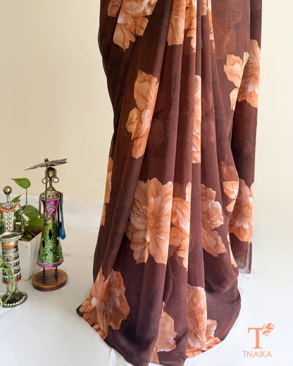 Brown georgette saree with large pink floral prints