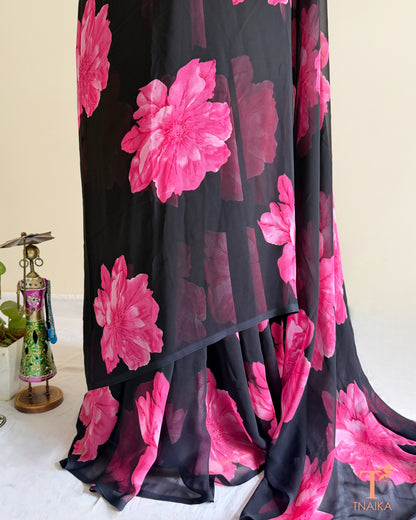 Black georgette saree with large pink floral prints