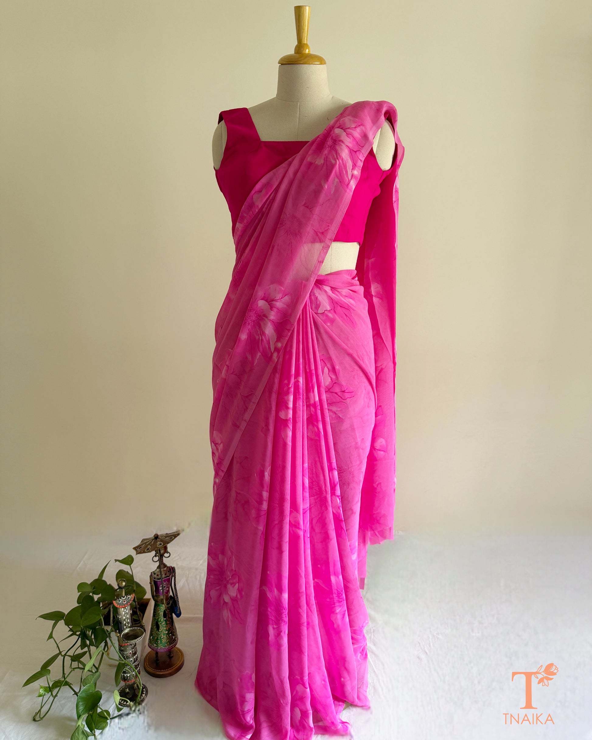 Bright pink saree with pink blossom design