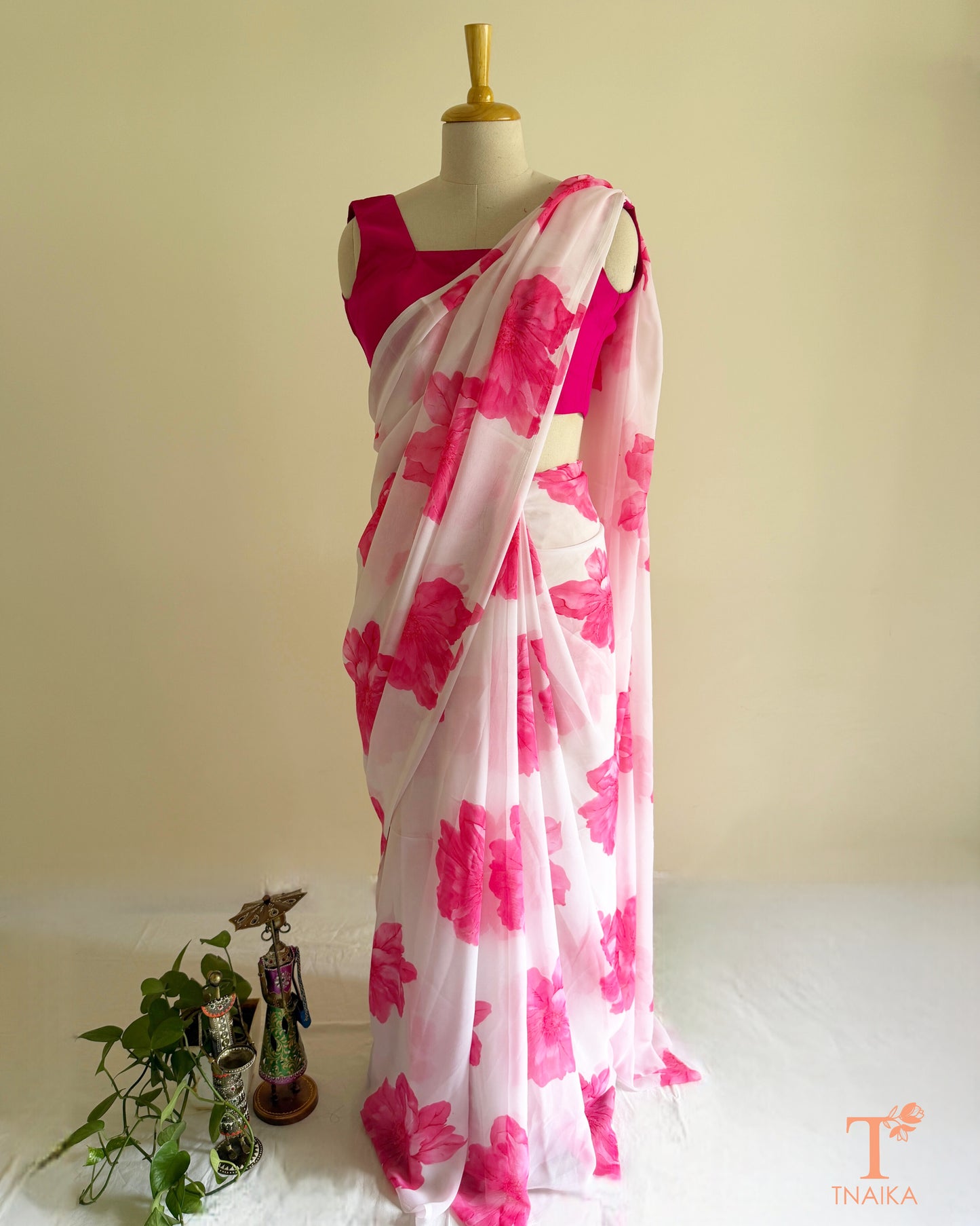 White georgette saree with large pink floral prints