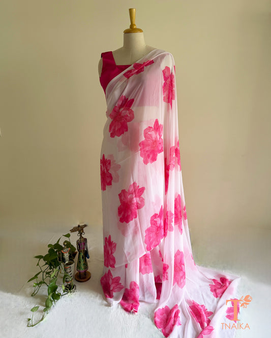 Bright white saree with pink blossom design