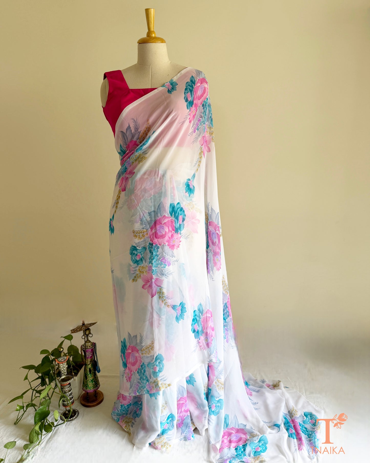White floral georgette saree with pastel blossom design