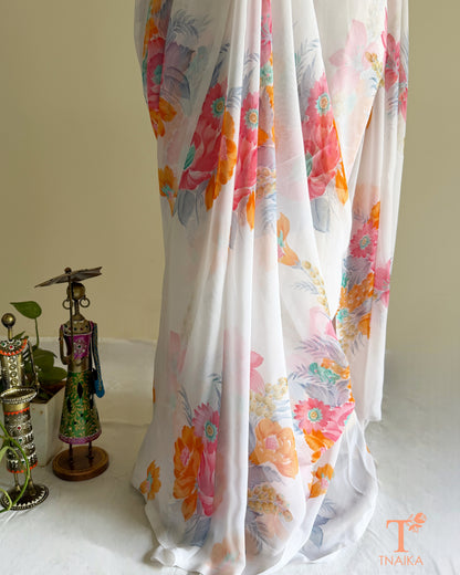 White saree with orange, purple and pastel floral prints