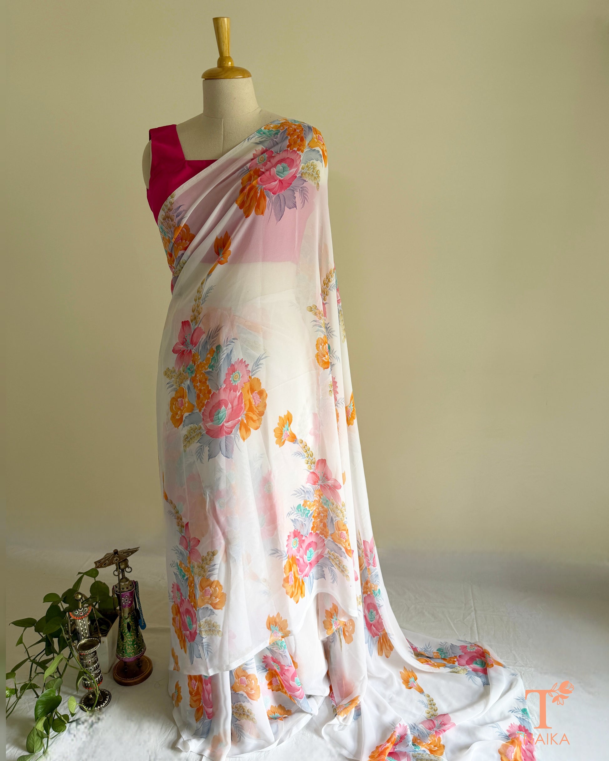 Flowy white floral saree for festive and casual occasions