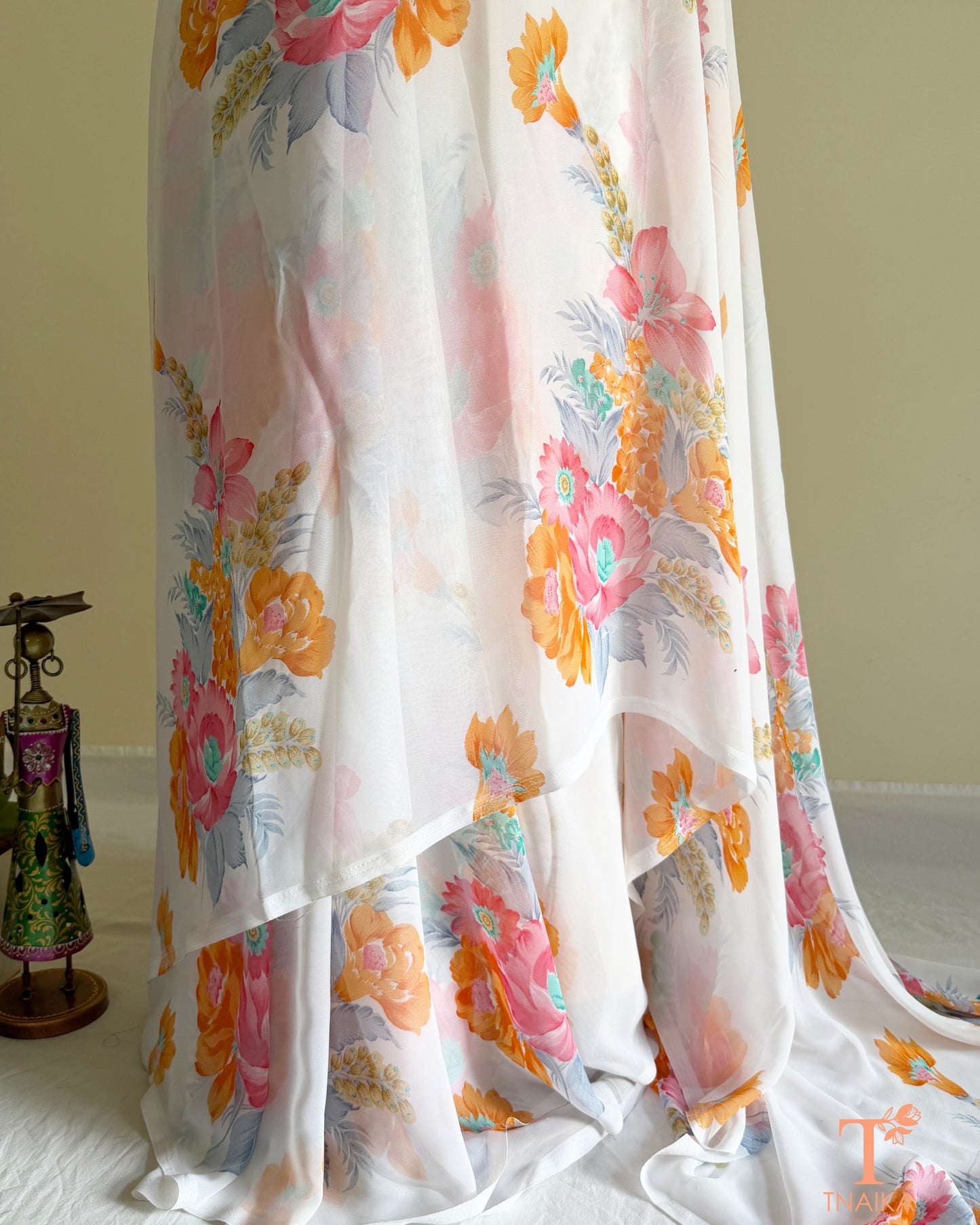 White floral georgette saree with pastel blossom design