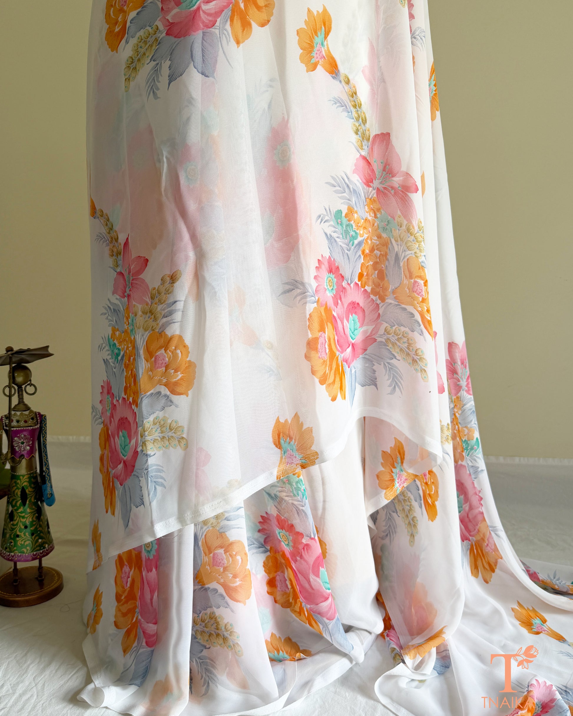 White floral georgette saree with pastel blossom design