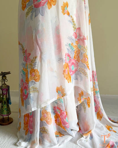 White floral georgette saree with pastel blossom design