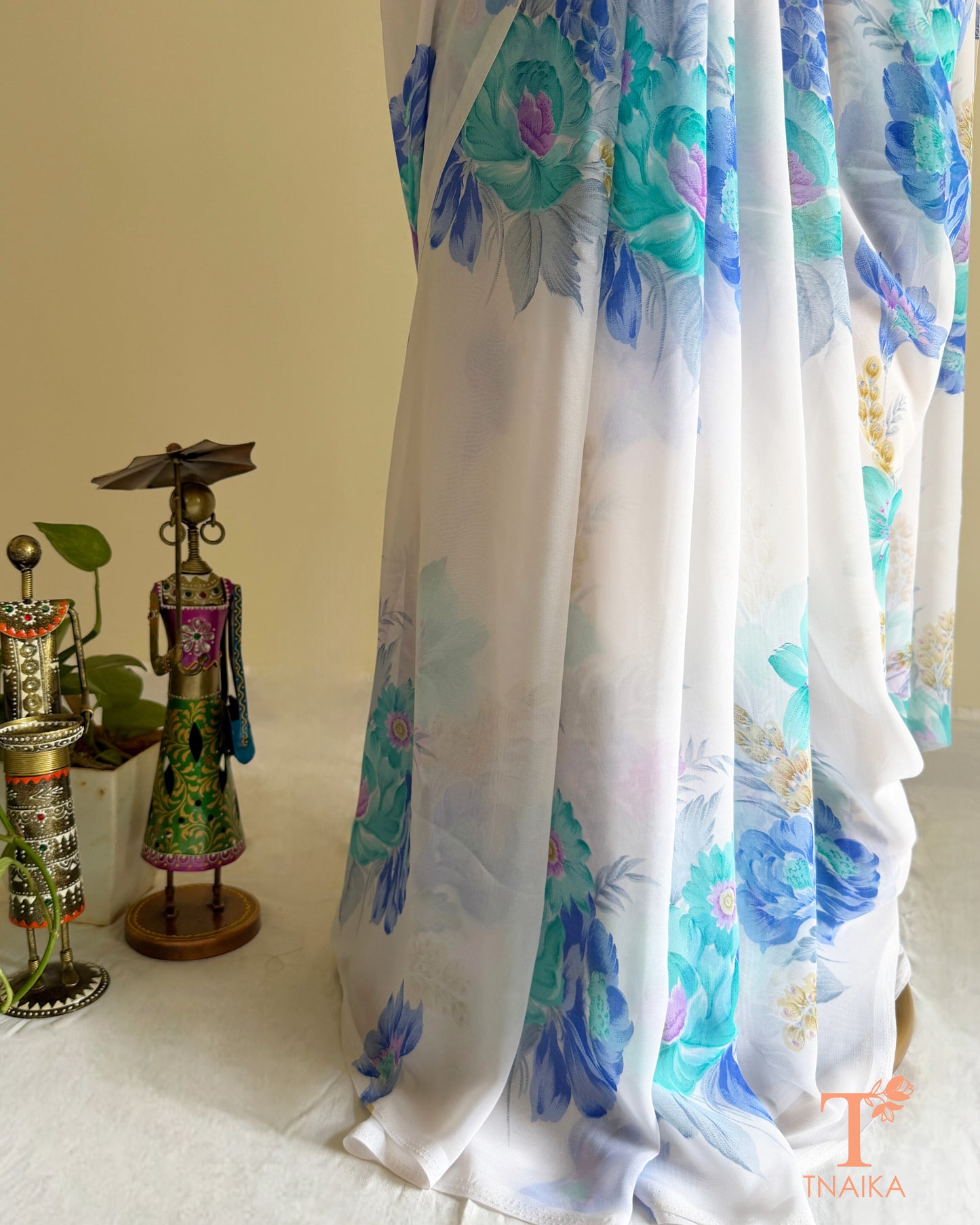 Flowy white floral saree for festive and casual occasions