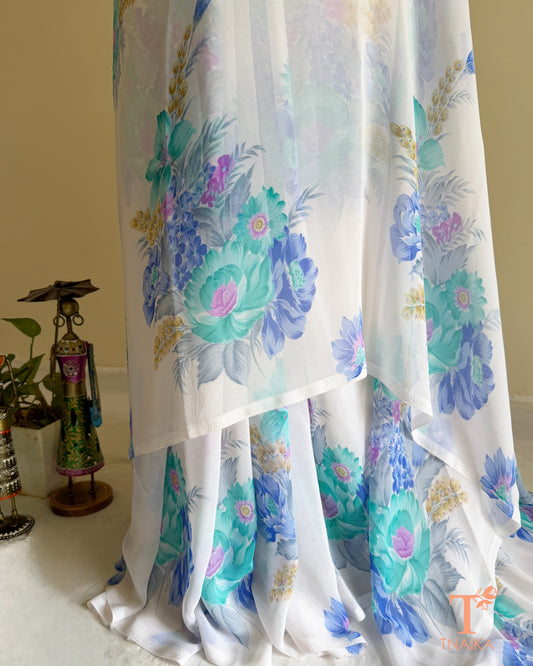 White floral georgette saree with pastel blossom design