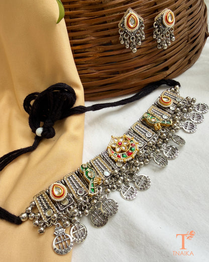 Close-up of Rajsi Kundan Virasat oxidised choker with handcrafted bird motifs, kundan embellishments, pearl accents, ghungroo detailing and matching stud earrings.