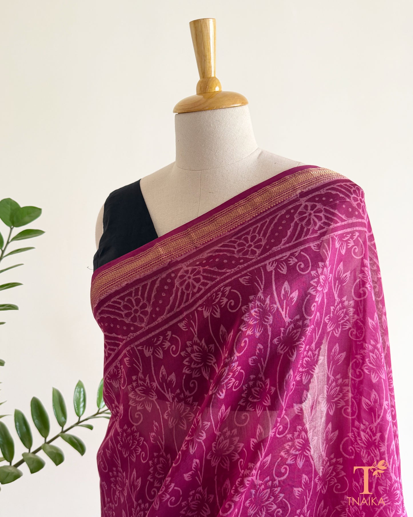 Royal wine silk saree with handcrafted motifs and shimmering zari accents