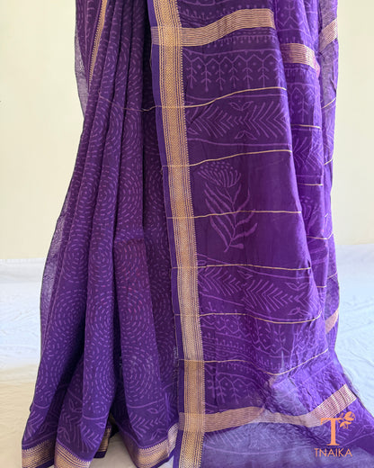 Elegant purple hand-block printed saree with delicate zari border detailing