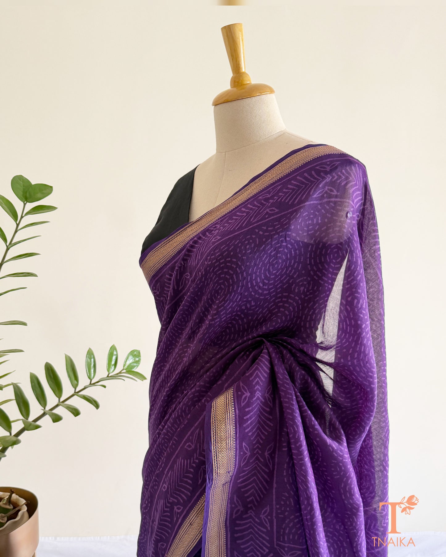 Royal purple silk saree with handcrafted motifs and shimmering zari accents