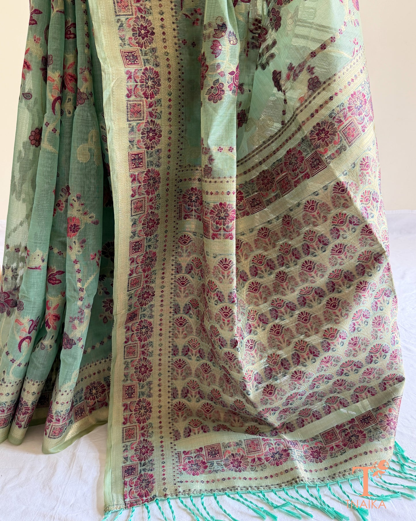 Traditional linen cotton saree with floral heritage print and soft breathable fabric.