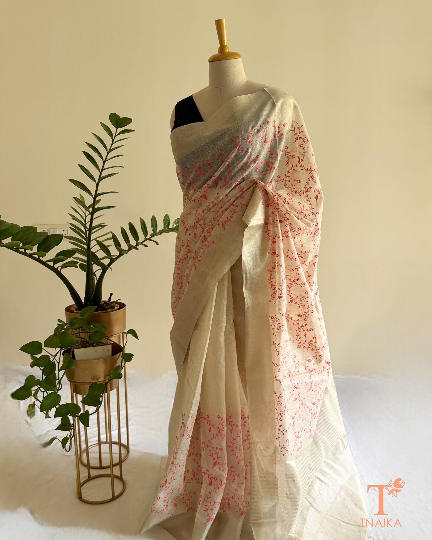 Embroidered ivory saree with striped pallu detailing