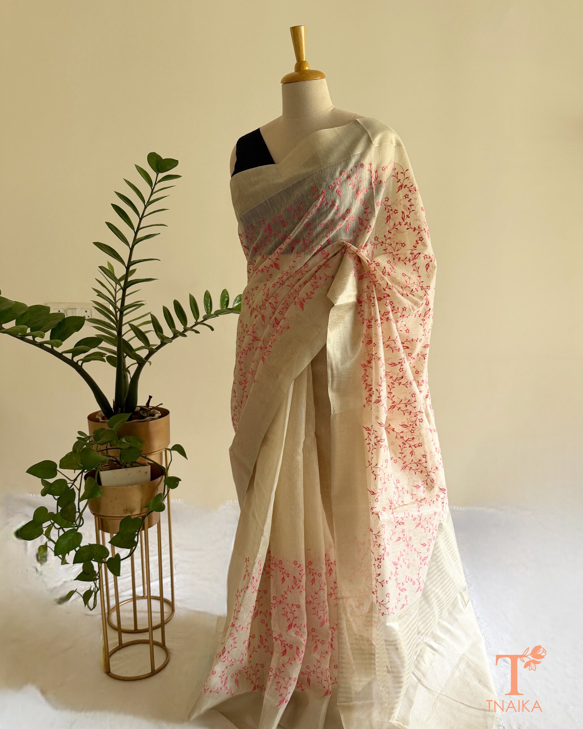 Embroidered ivory saree with striped pallu detailing