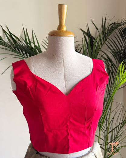 Front view of a padded cotton silk blouse with sweetheart paan shape-neckline, broad shoulder straps, and premium fit.