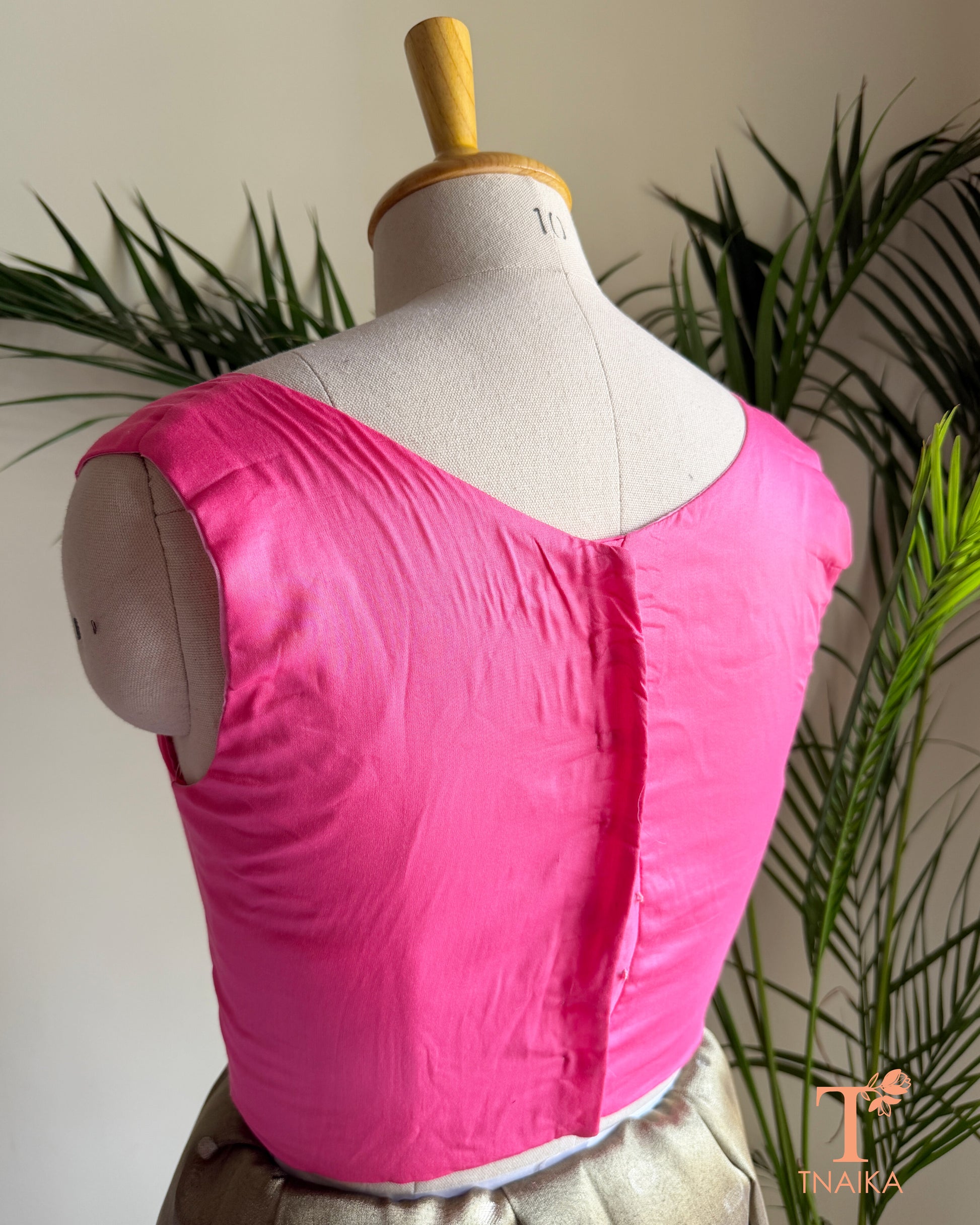 Back view of cotton silk blouse with clean tailored finish and comfortable cotton lining.