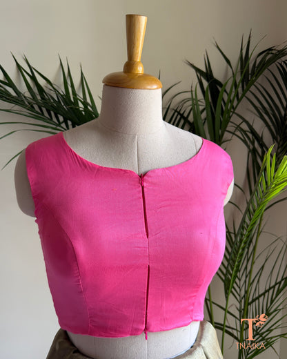 Close-up of the contemporary notched neckline and dual front zip detail .