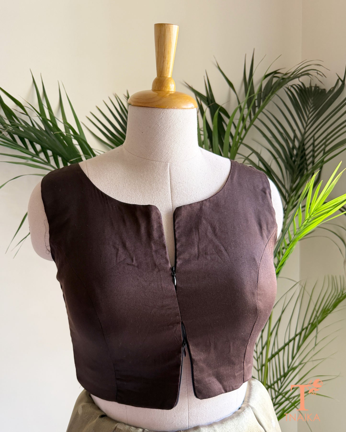Cotton Silk sleeveless blouse featuring a modern notched round neckline and adjustable dual front zipper.