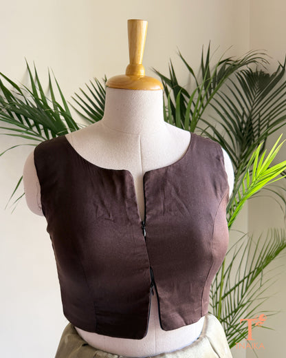 Cotton Silk sleeveless blouse featuring a modern notched round neckline and adjustable dual front zipper.