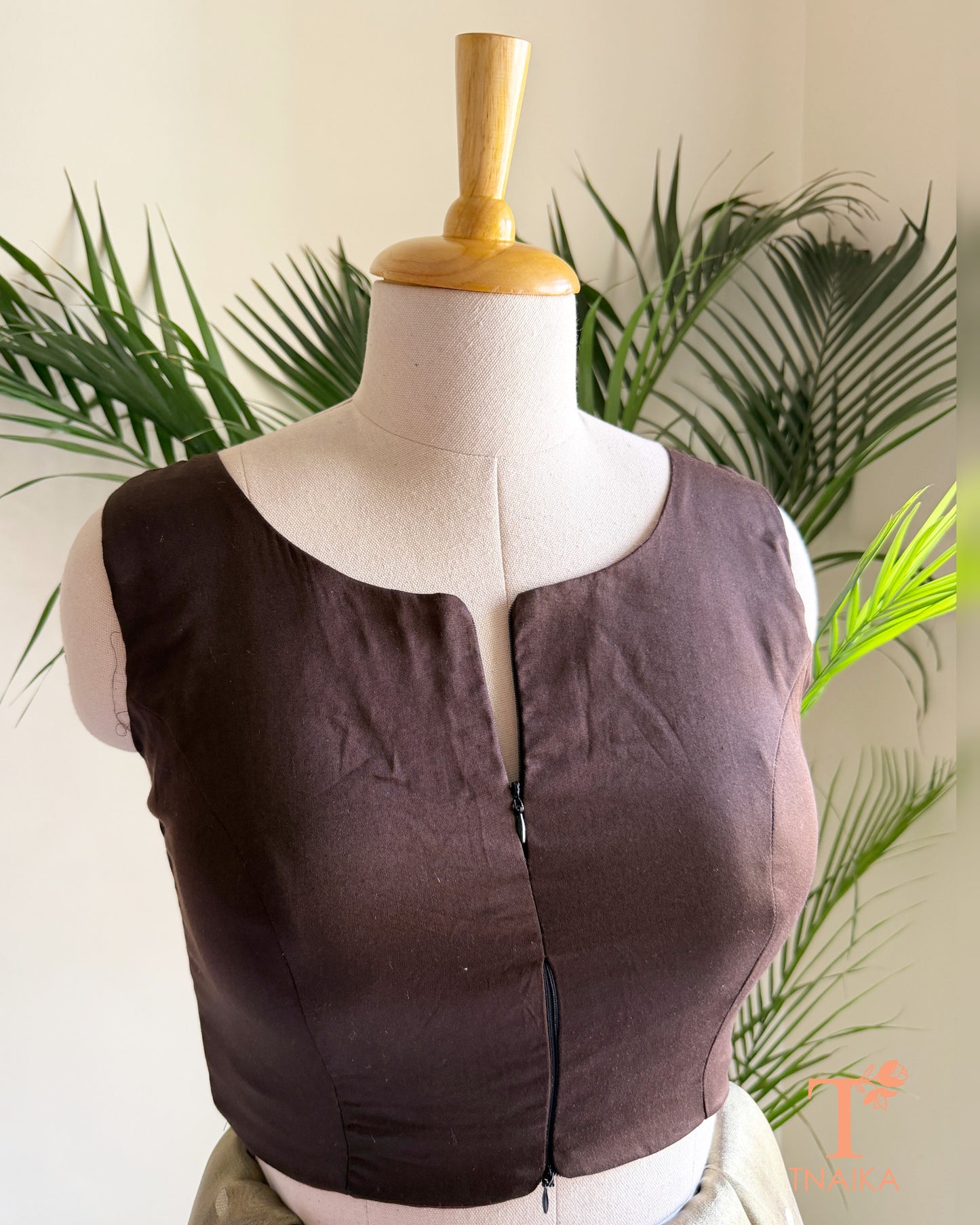 Cotton Silk sleeveless blouse featuring a modern notched round neckline and adjustable dual front zipper.