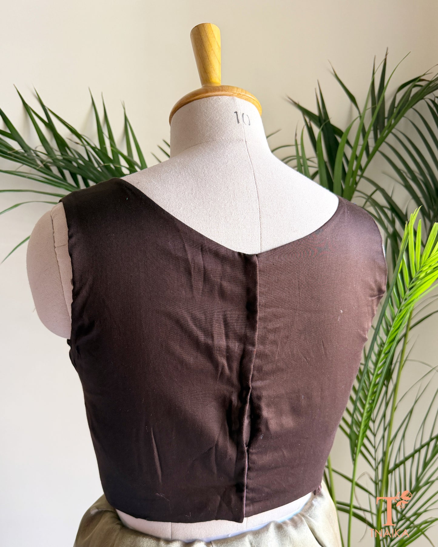 Back view of cotton silk blouse with clean tailored finish and comfortable cotton lining.