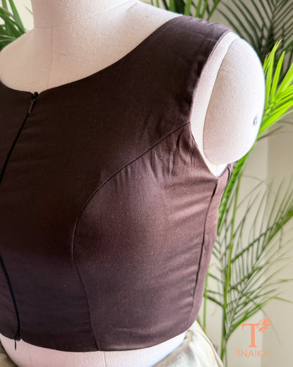 Side profile of the silk blend blouse highlighting the flattering princess-cut tailoring and structured silhouette.