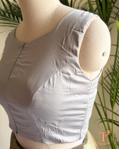 Side profile of cotton silk blouse highlighting the flattering princess-cut tailoring and structured silhouette.