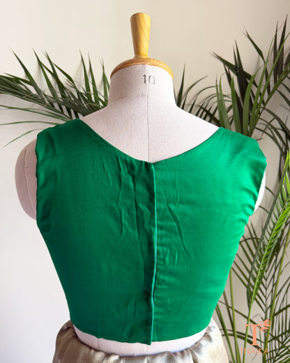 Back view of emerald green silk blend blouse with clean tailored finish and comfortable cotton lining.