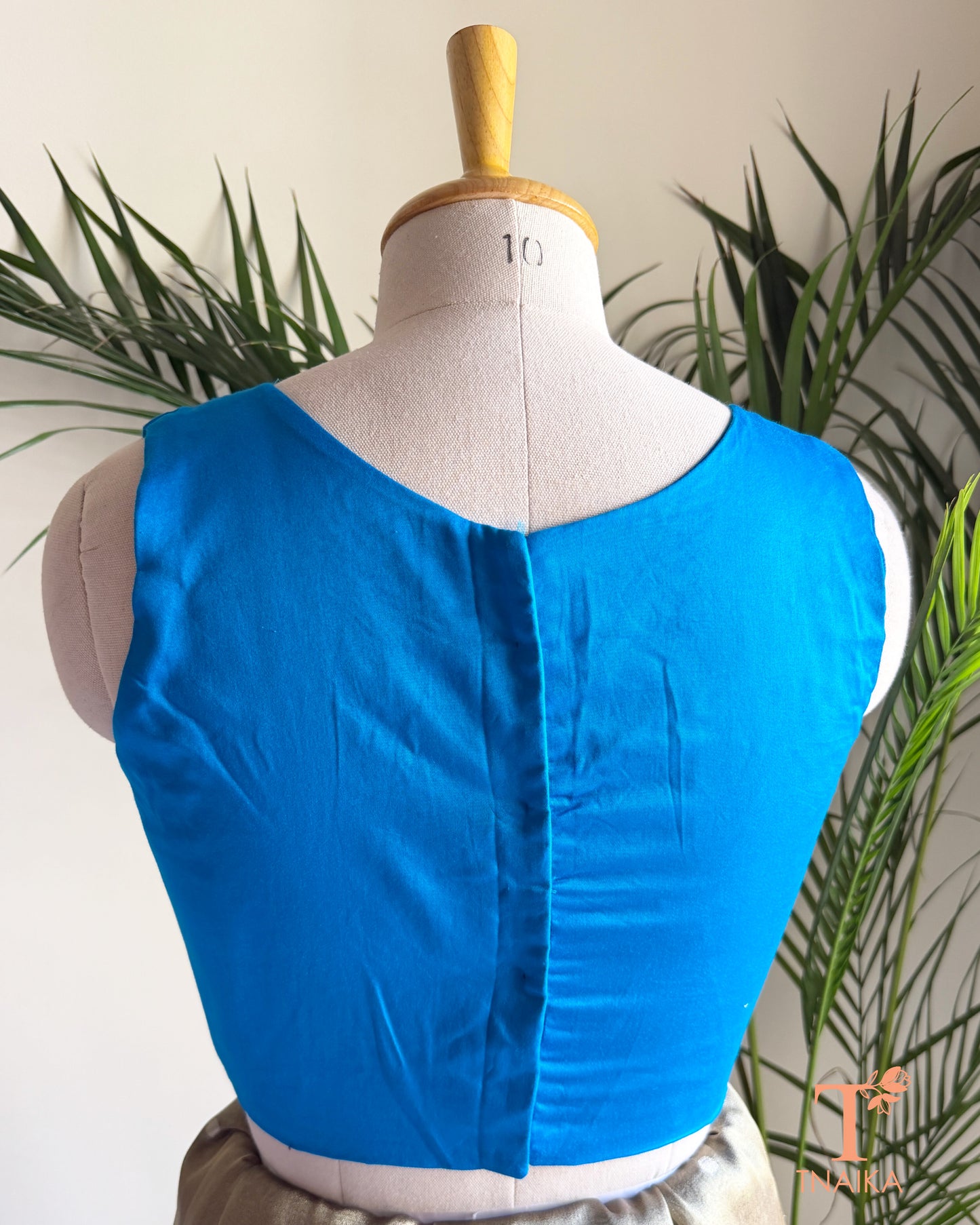 Back view of cotton silk blouse with clean tailored finish and comfortable cotton lining.