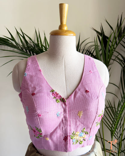 Front view of embroidered Kota silk blouse featuring floral motifs and a flattering V-neck design.