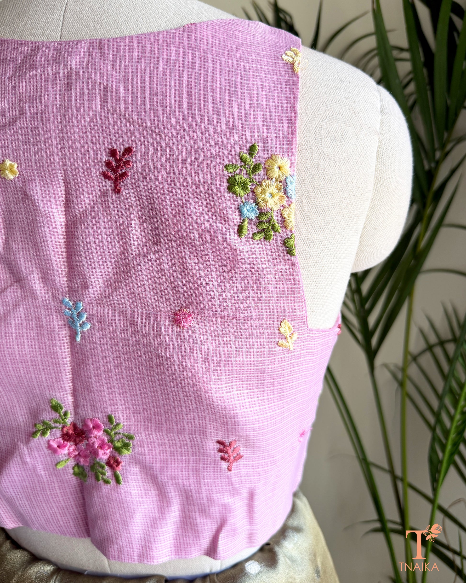 Close-up of floral embroidery detailing on premium Kota silk blouse showcasing handcrafted artistry.