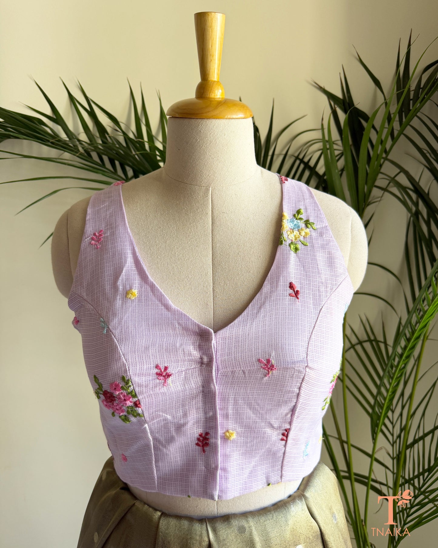 Front view of embroidered Kota silk blouse featuring a flattering V-neckline and intricate floral embroidery detailing.
