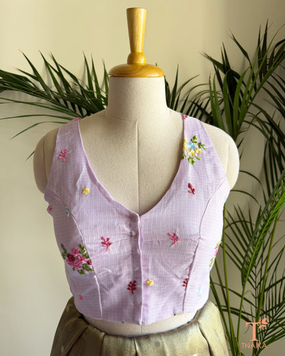 Front view of embroidered Kota silk blouse featuring a flattering V-neckline and intricate floral embroidery detailing.