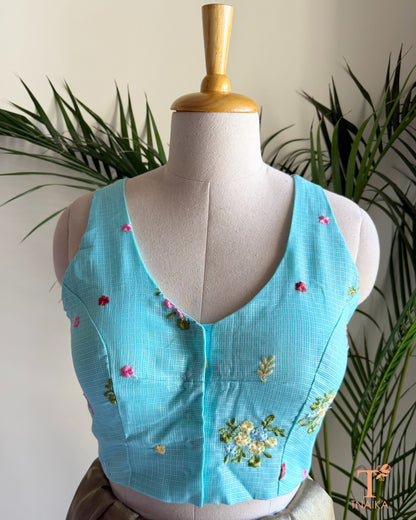 Front view of embroidered Kota silk blouse featuring a flattering V-neckline and intricate floral embroidery detailing.
