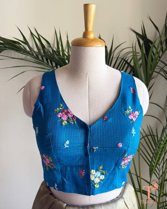 Front view of embroidered Kota silk blouse featuring floral motifs and a flattering V-neck design.